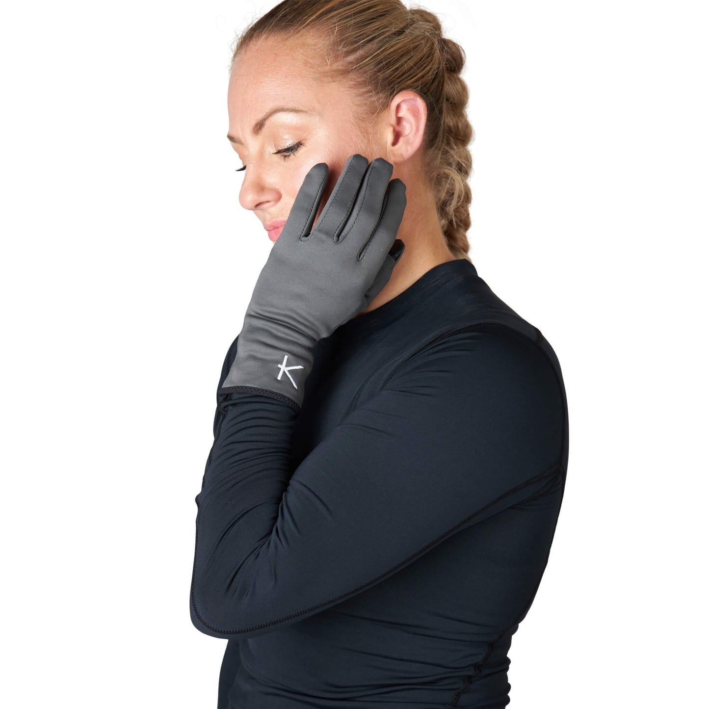 Woman wearing a black long-sleeve shirt and gray gloves with a logo on a white background
