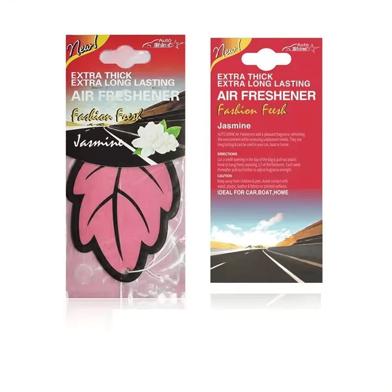 Two packages of air freshener with pink leaf design on a white background