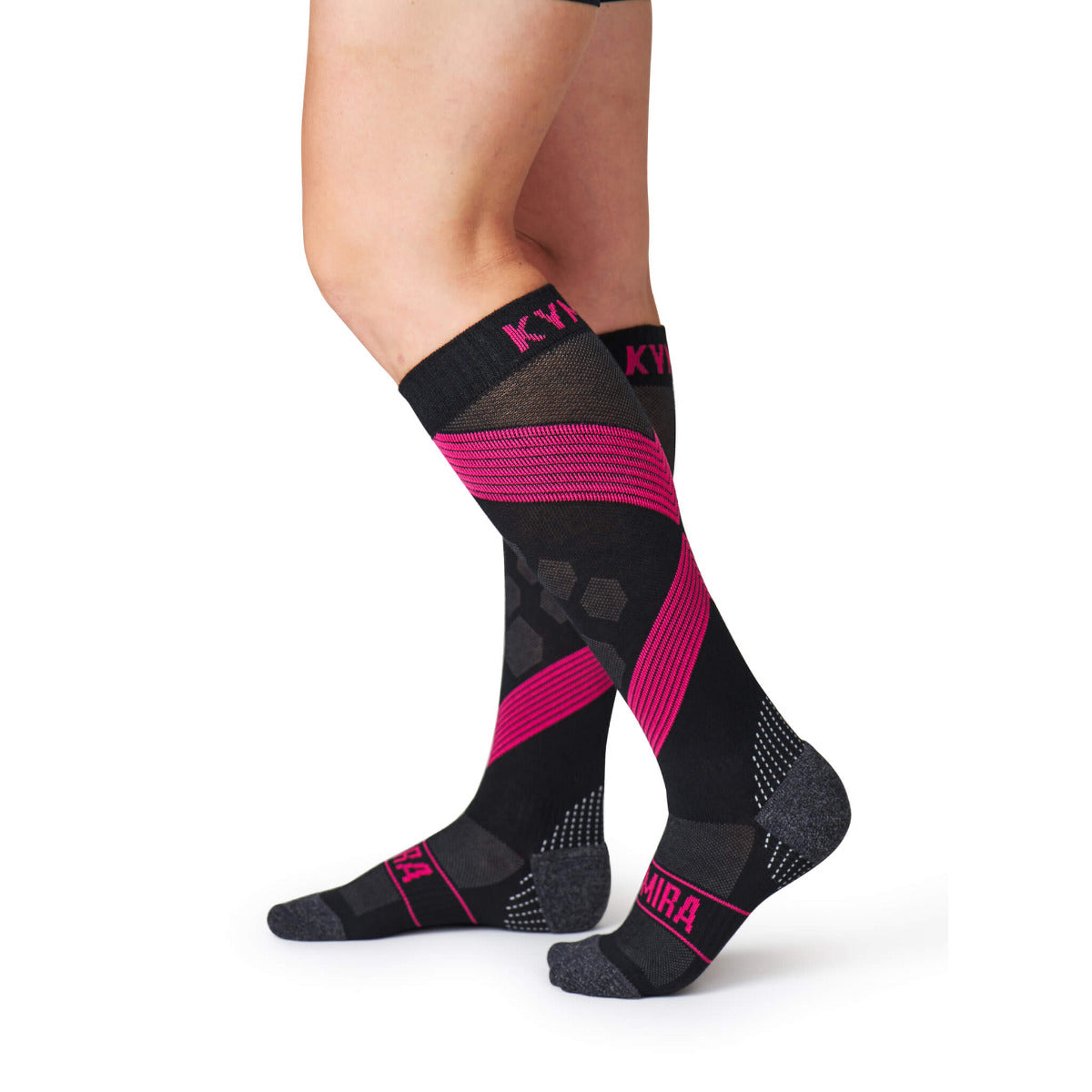 Black and pink socks with 'Kari Traa' branding on a white background