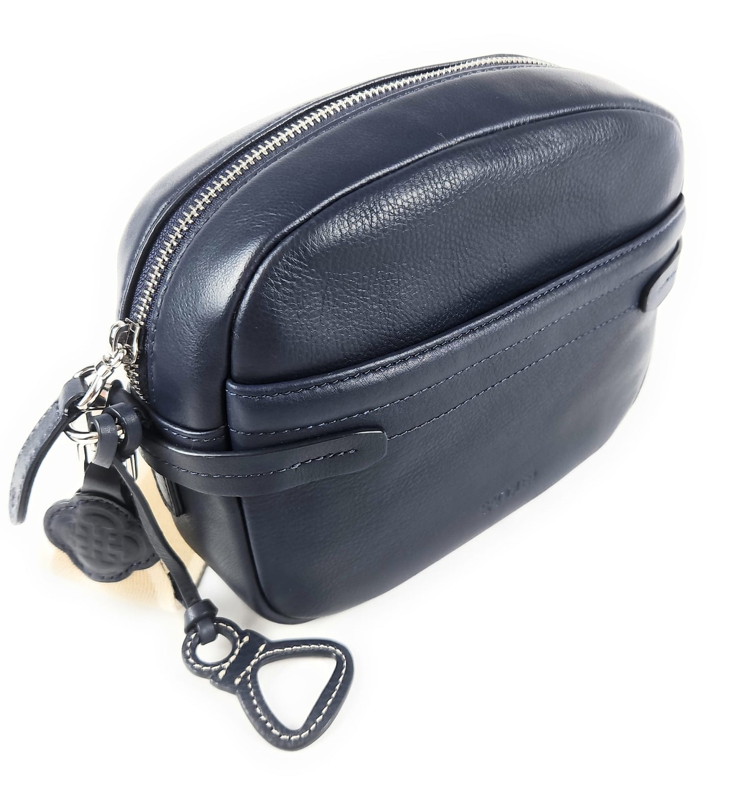 Navy blue leather bag with a strap on a white background