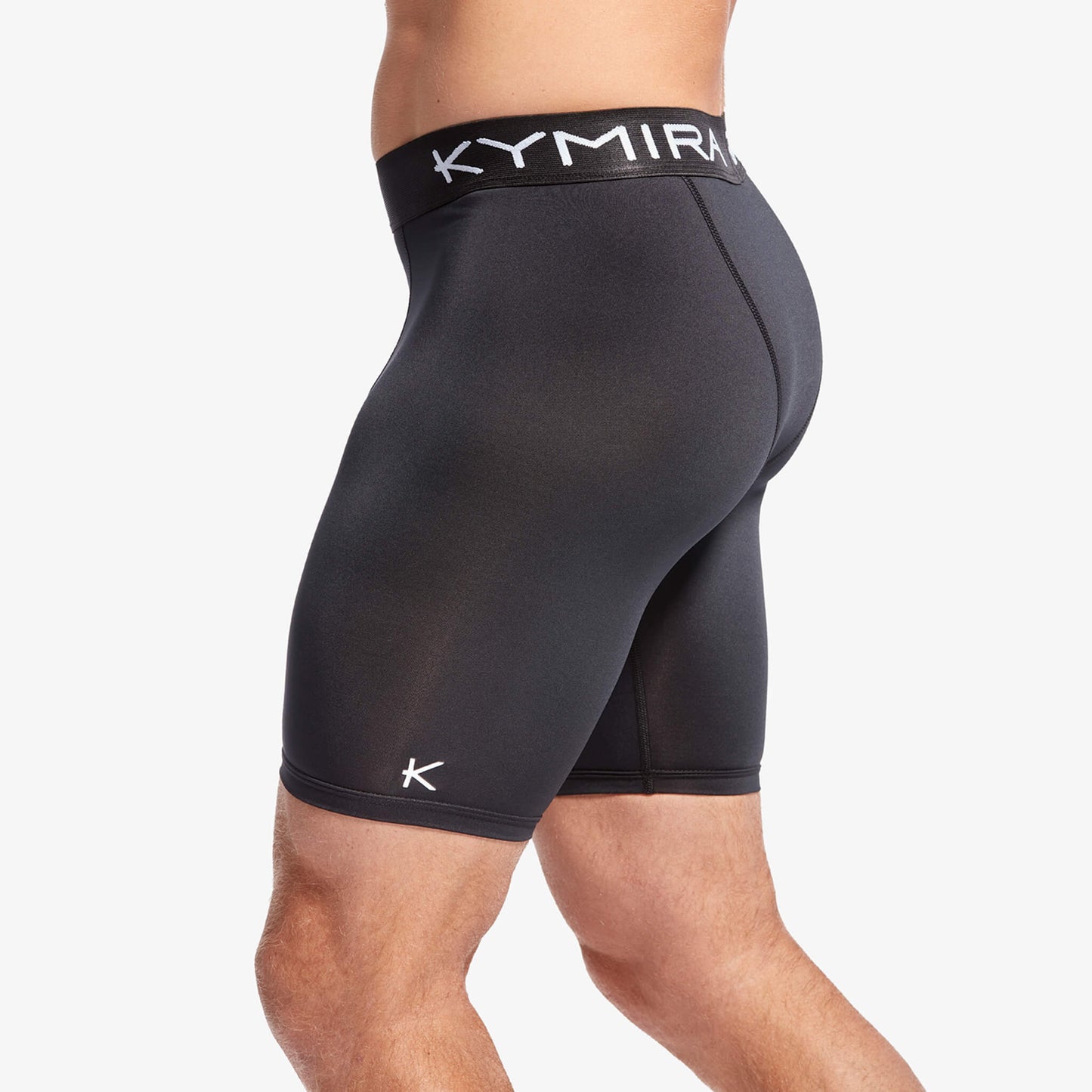 Black athletic shorts with a visible brand logo on a white background