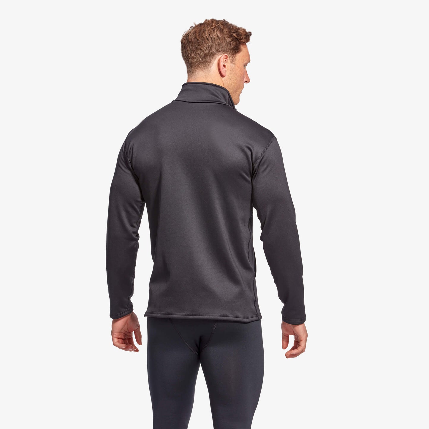 Man wearing a gray long-sleeve athletic shirt on a white background