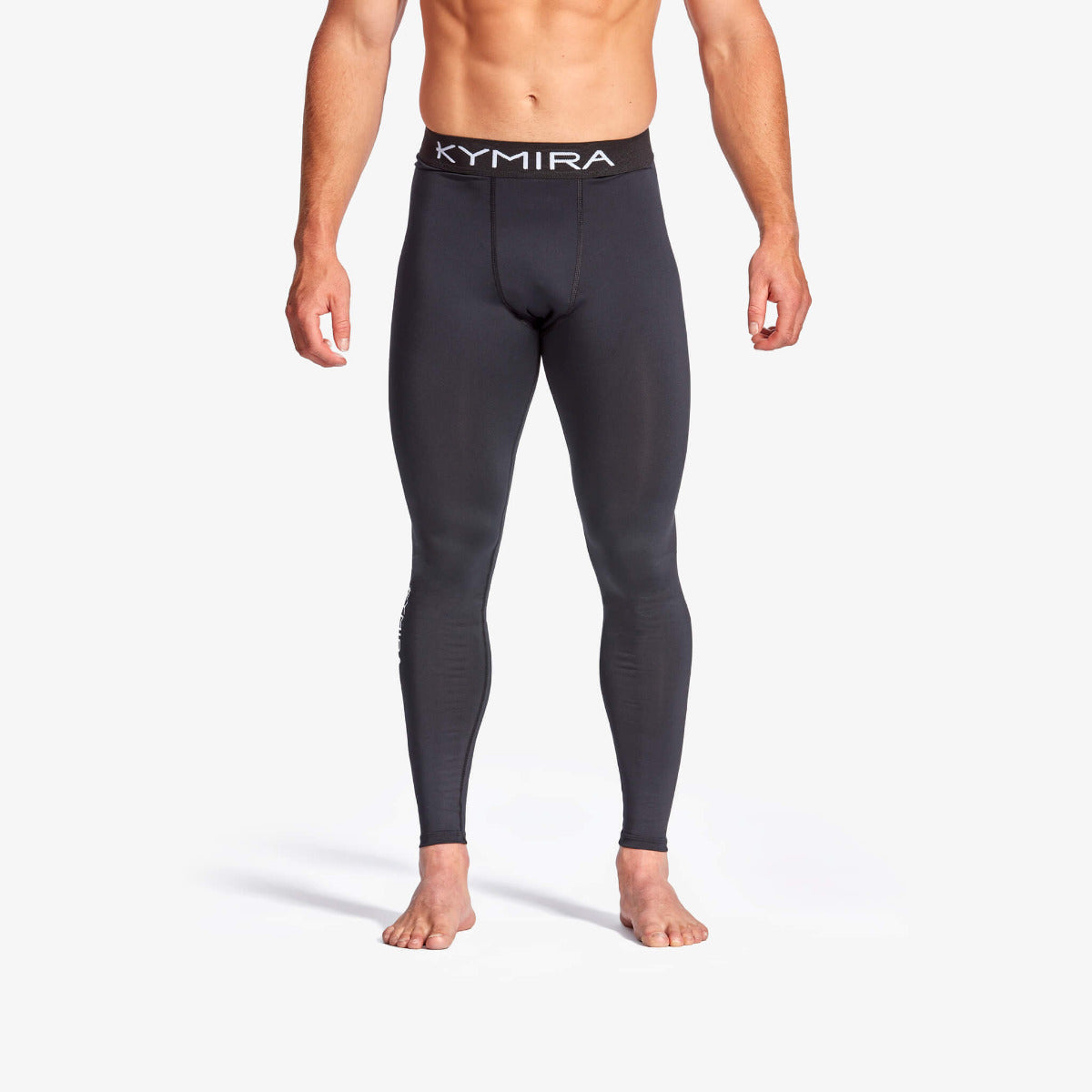 Person wearing black compression leggings with 'Kymira' branding on a white background