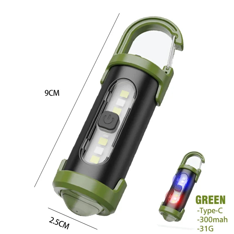 Green and black portable light with carabiner on a white background