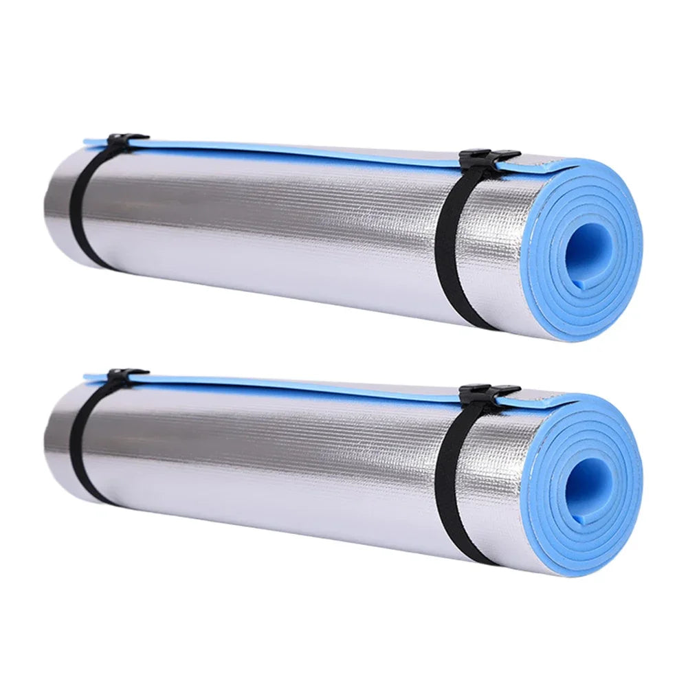 Two rolls of reflective insulation material with blue and silver layers on a white background