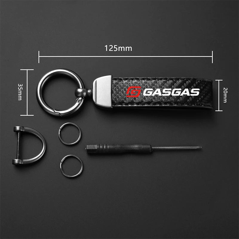 Keychain with measurements on a dark background