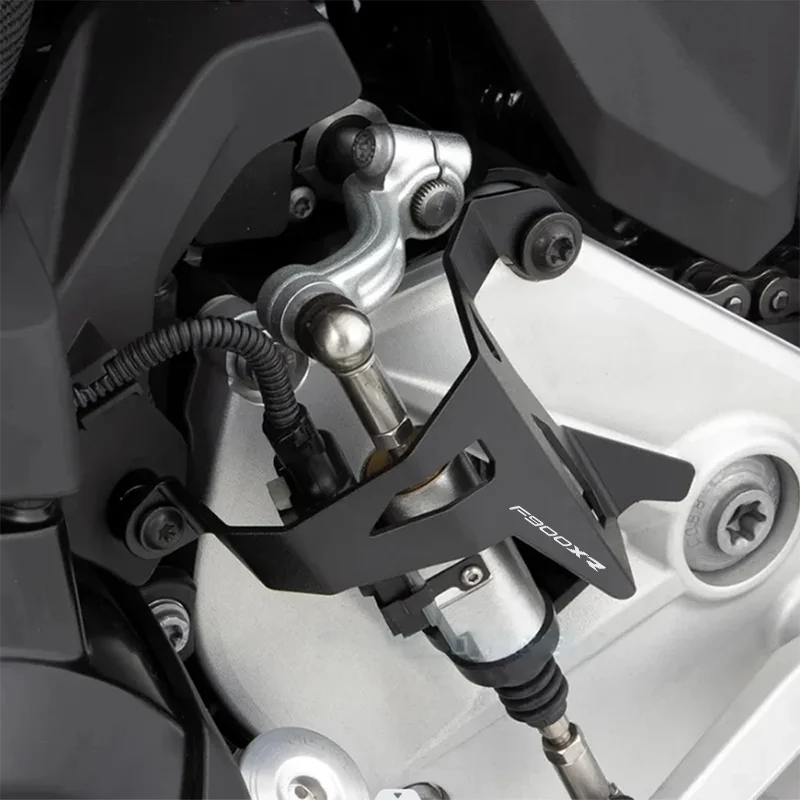 Close-up of a motorcycle suspension system with 'Fabbrica' branding.