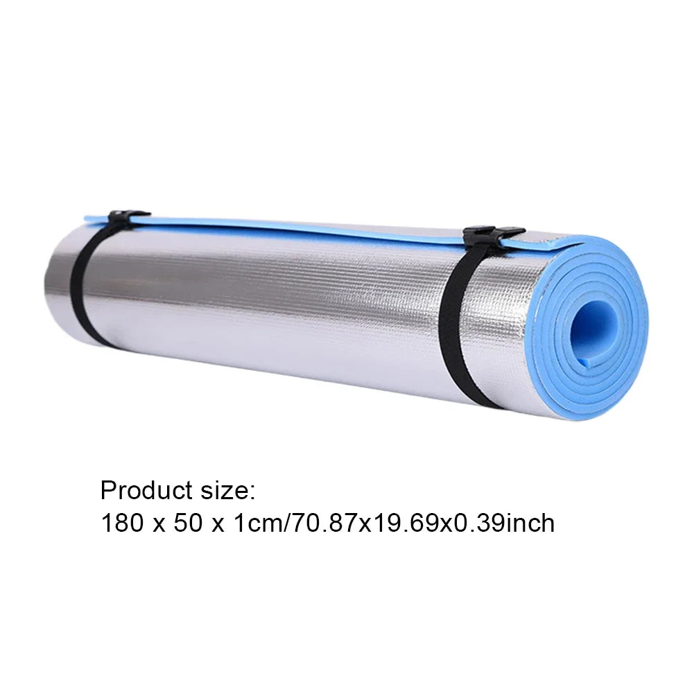 Roll of reflective insulation with blue edges on a white background