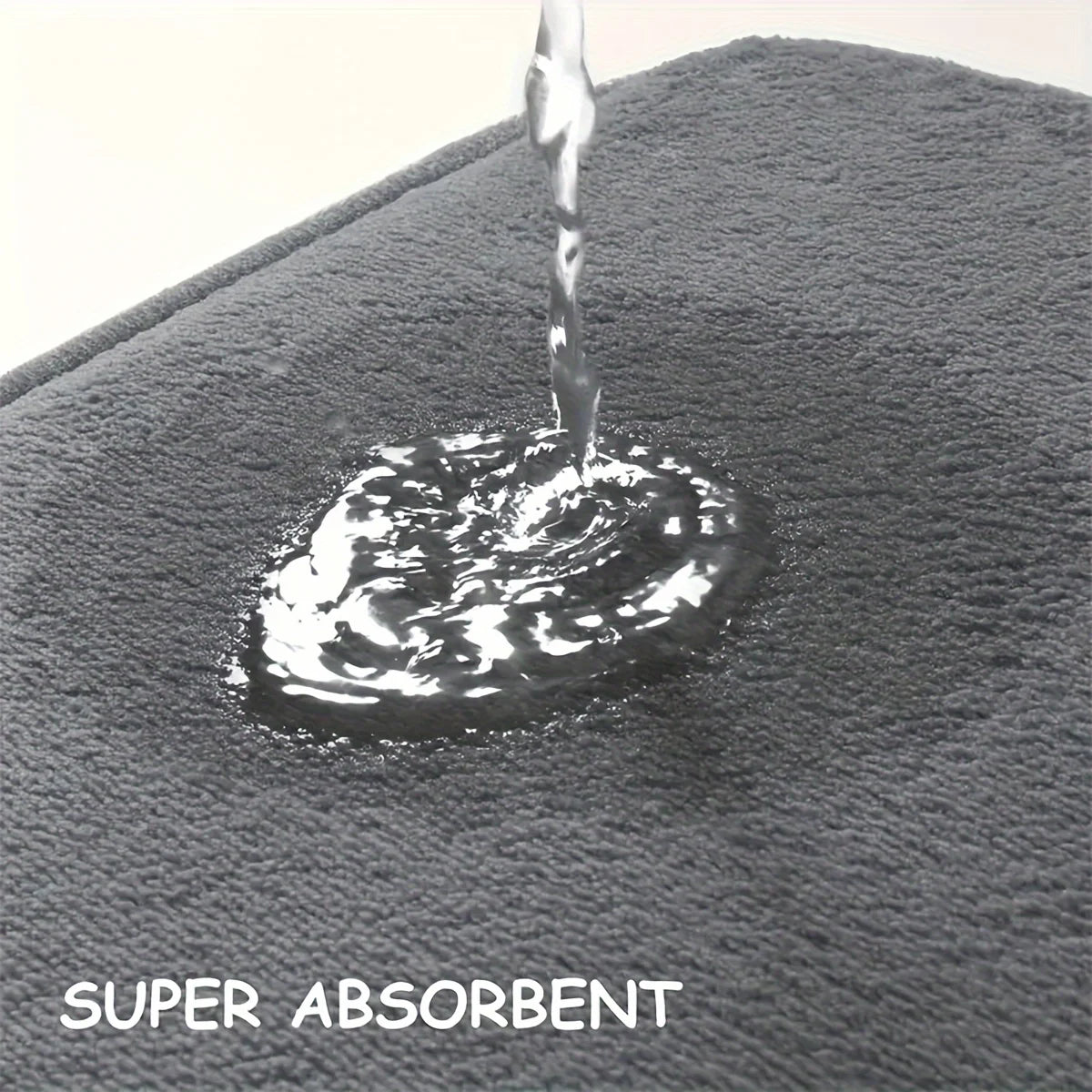 Gray towel with water droplet and 'SUPER ABSORBENT' text