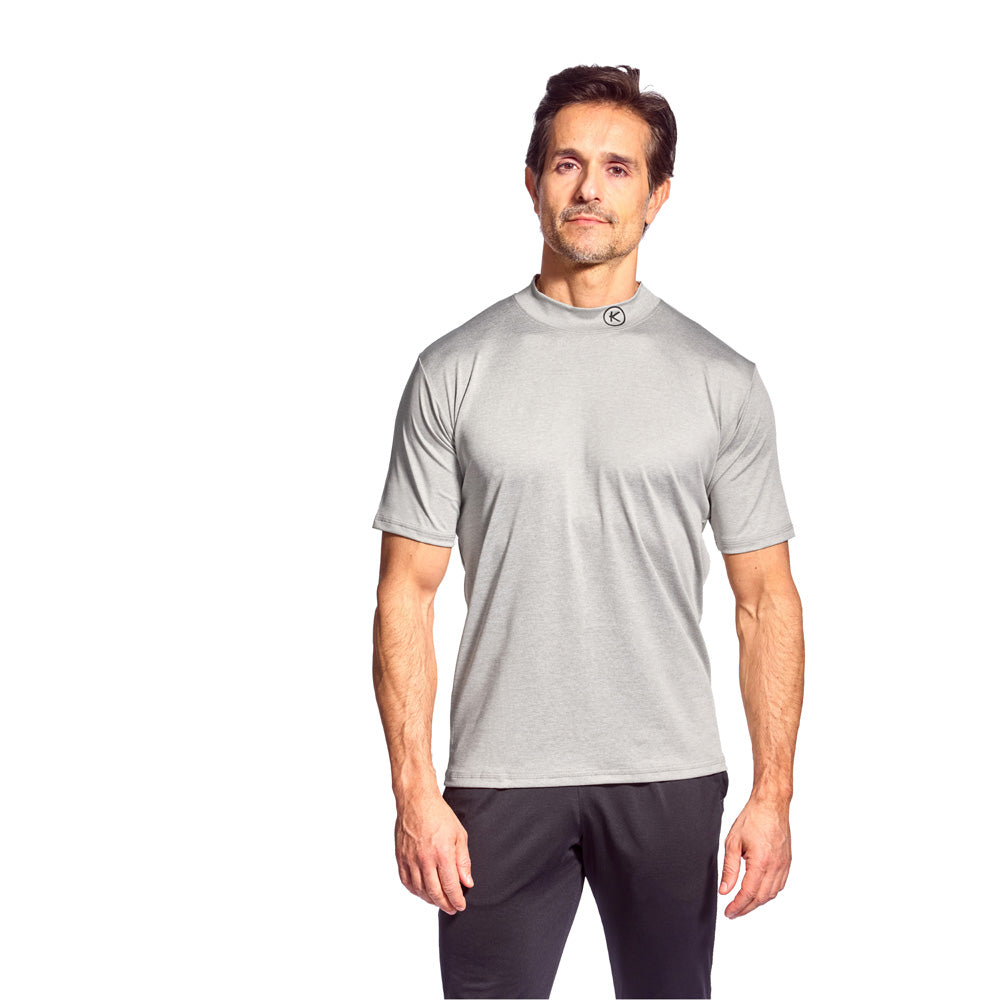 Man wearing a gray athletic shirt and black shorts on a white background