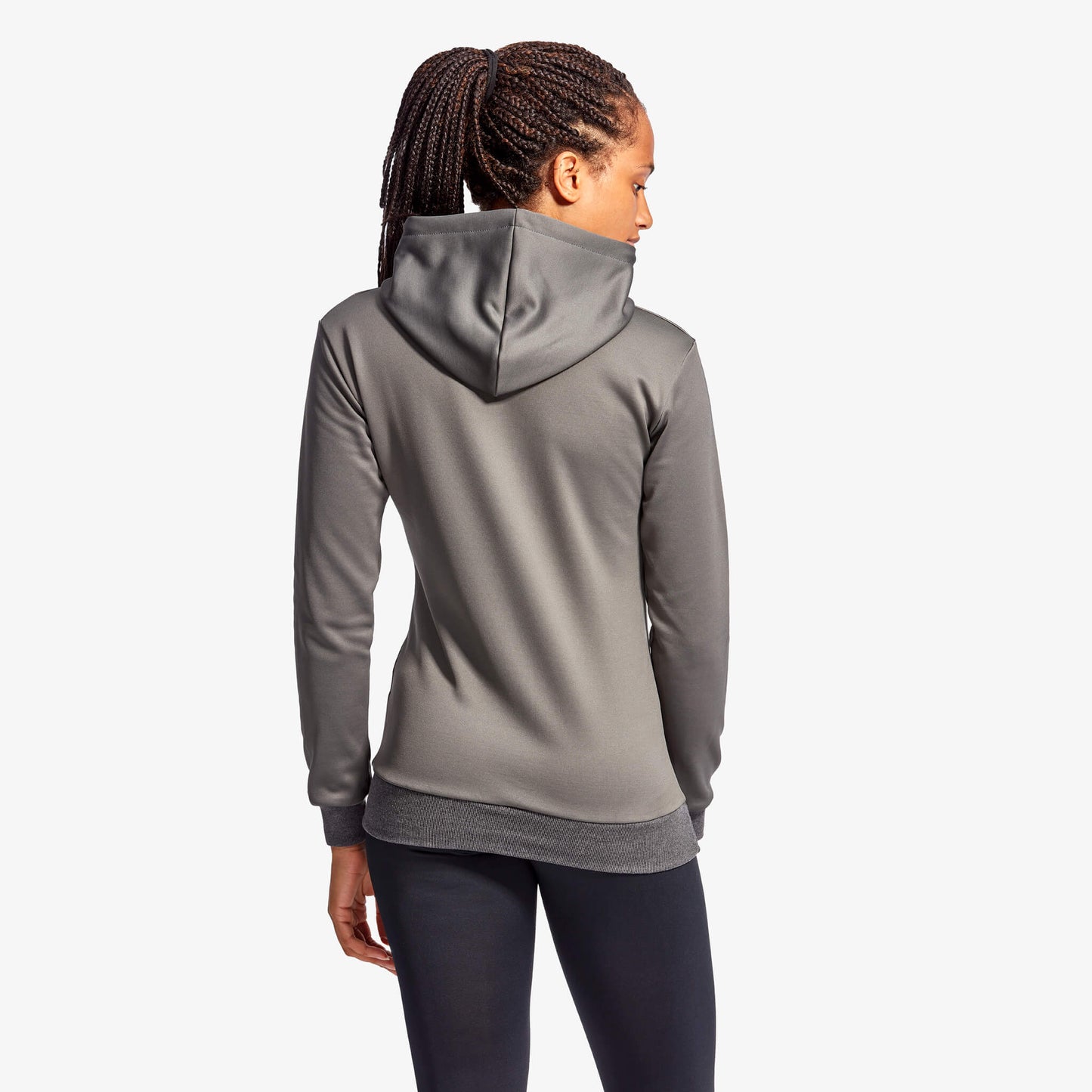 Person wearing a gray hoodie on a white background