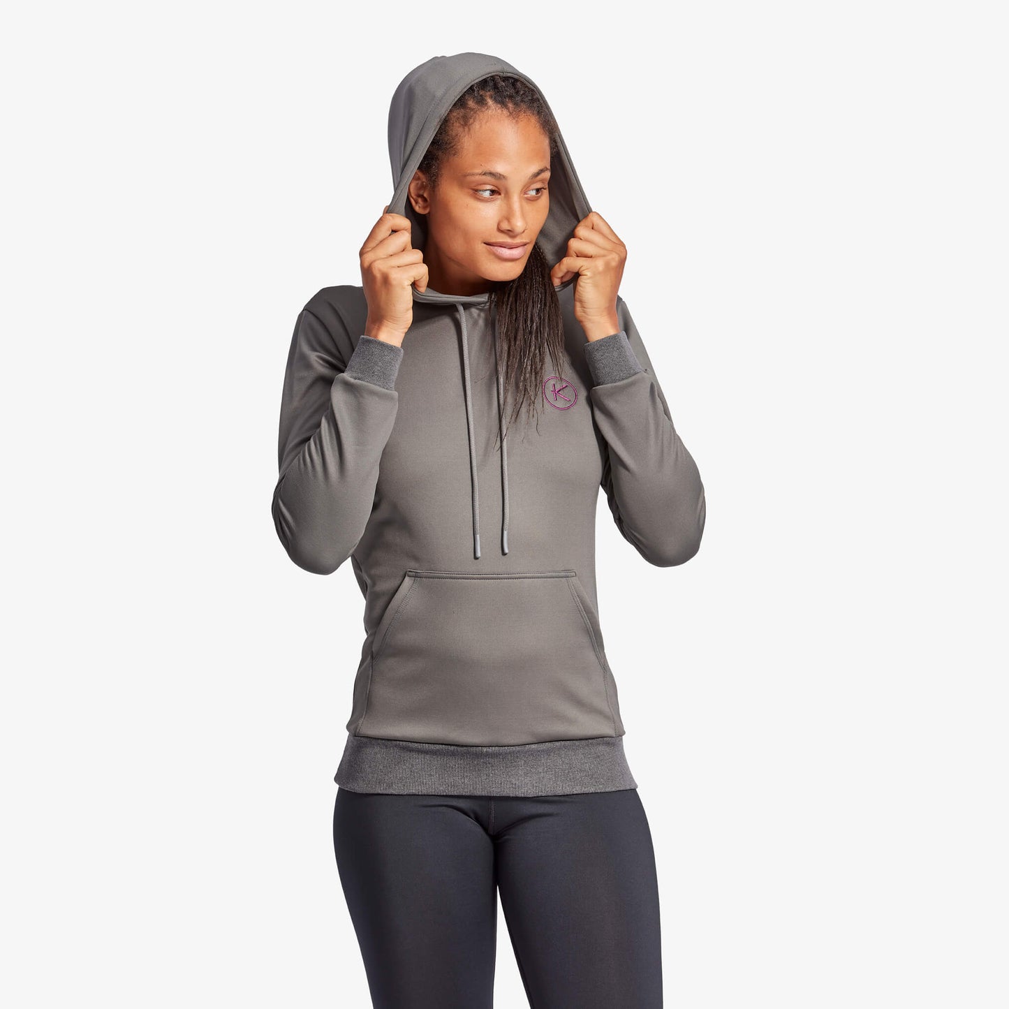 Woman wearing a gray hoodie on a white background