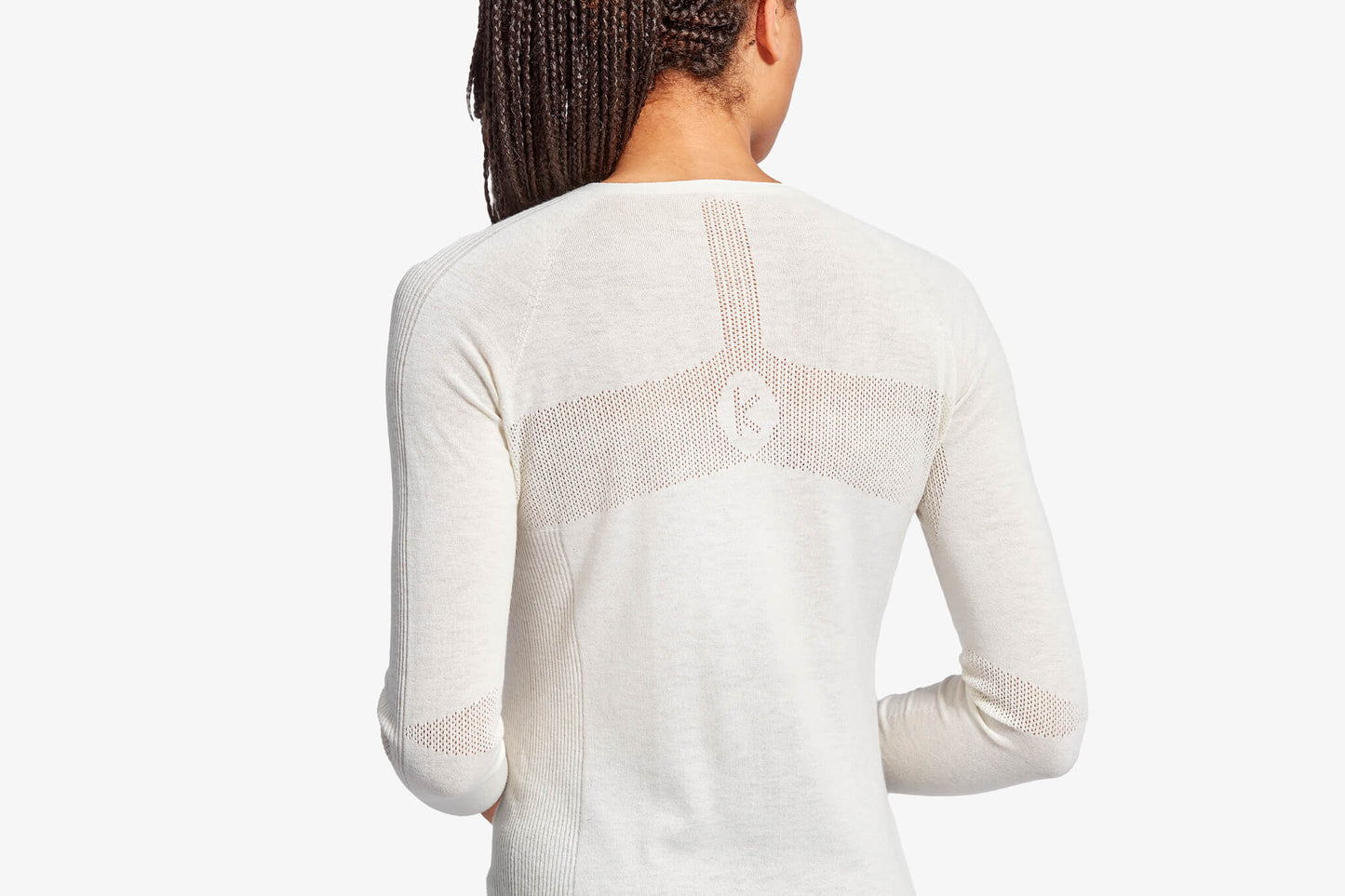 White long-sleeve top with mesh panels on a white background