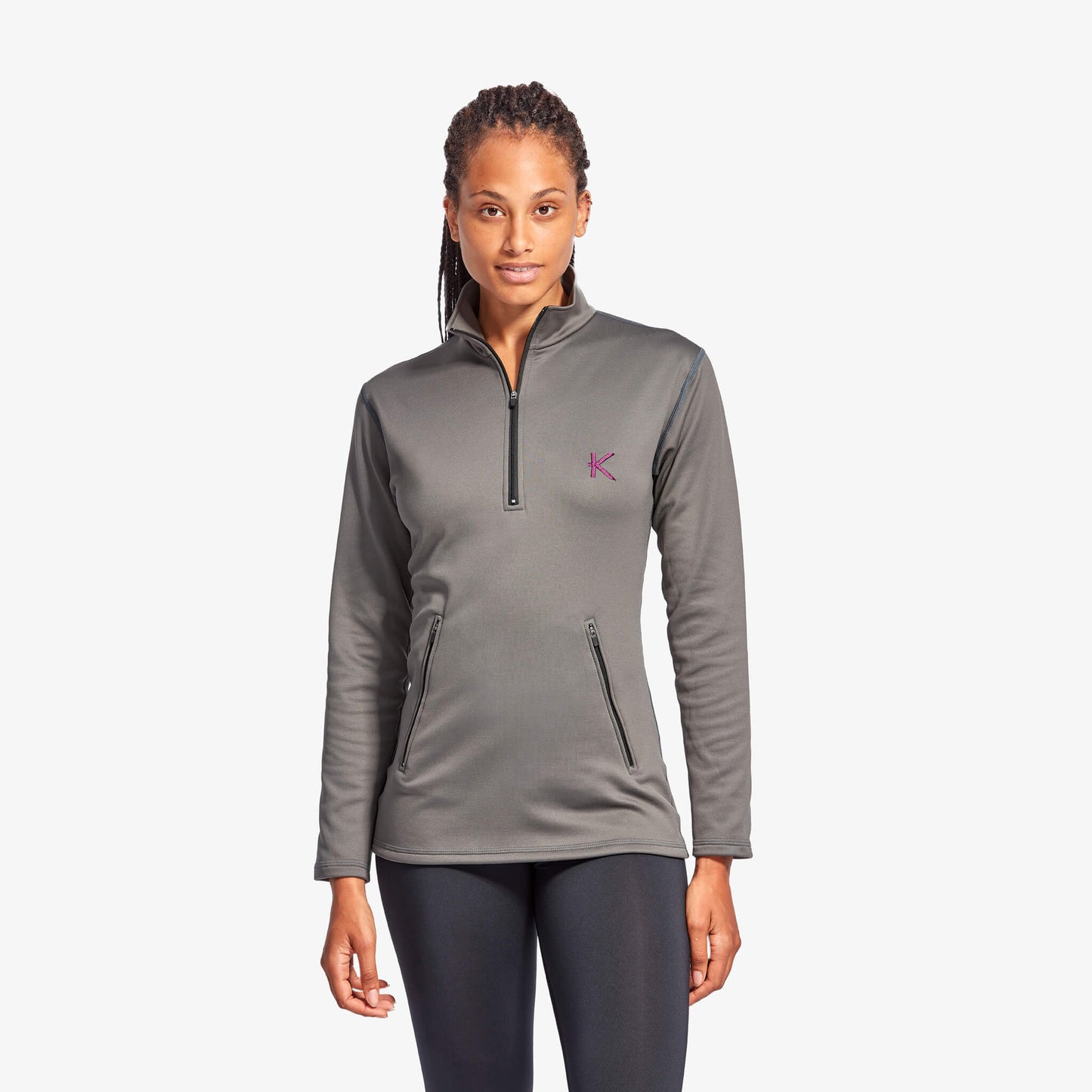 Woman wearing a gray pullover with a logo on a white background