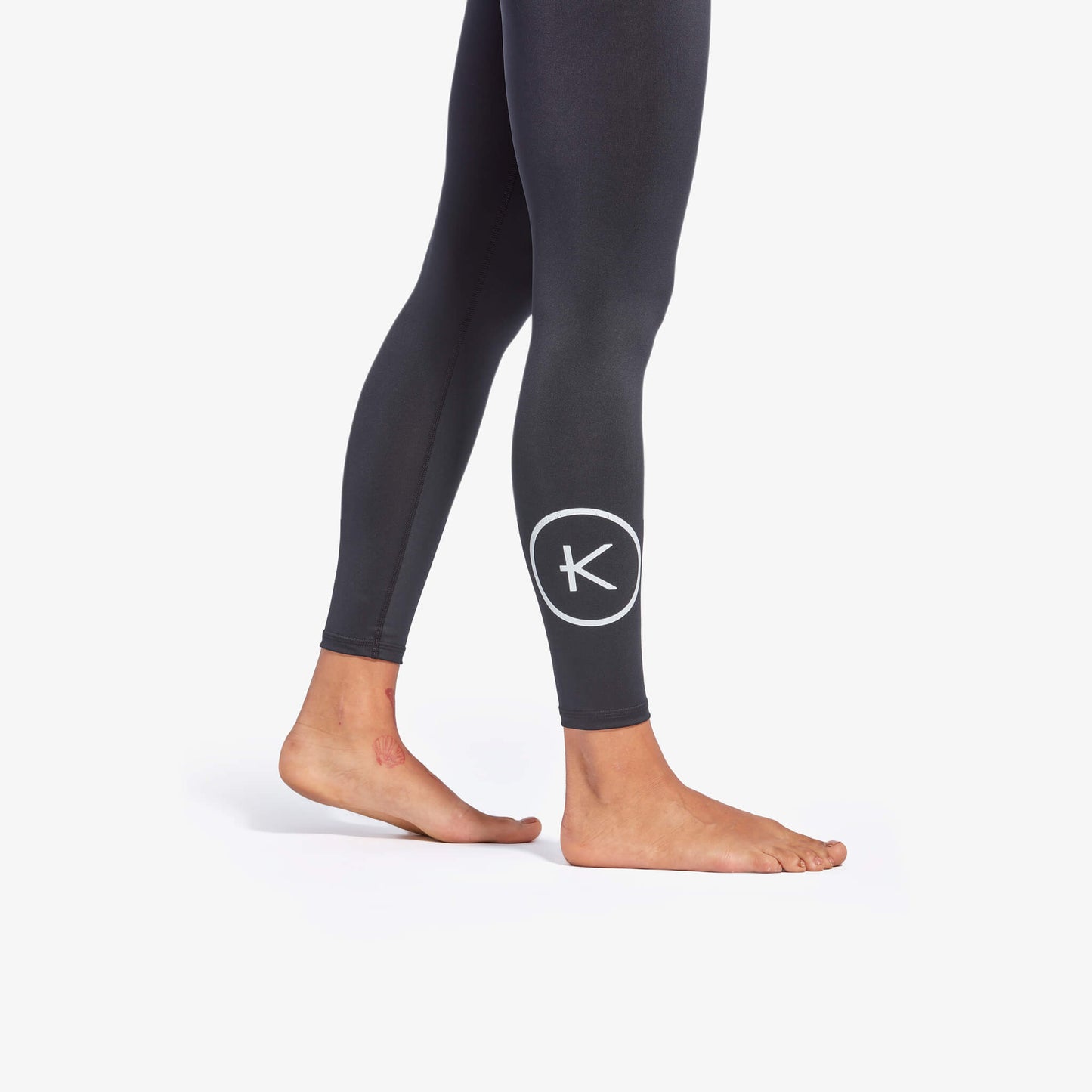Black leggings with a logo on a white background