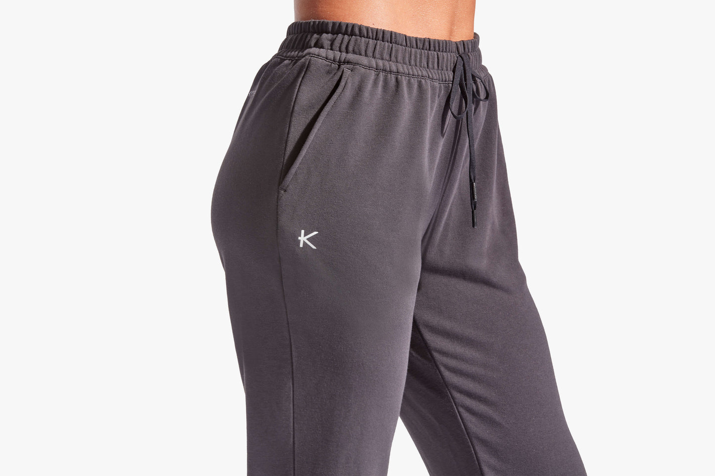 Gray sweatpants with a logo on a white background