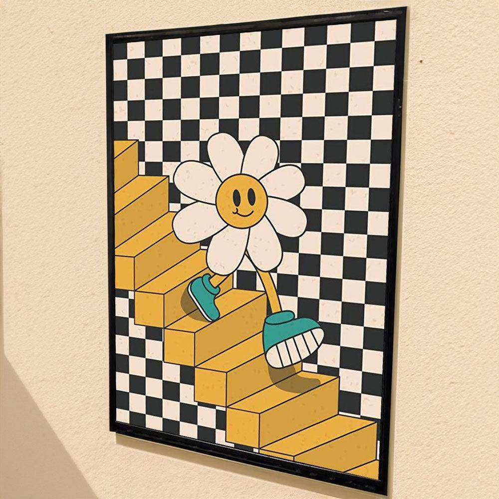 Framed artwork of a smiling flower character on yellow blocks with a checkered background.