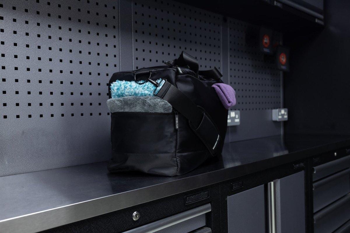 Black bag with colorful contents on a metal shelf