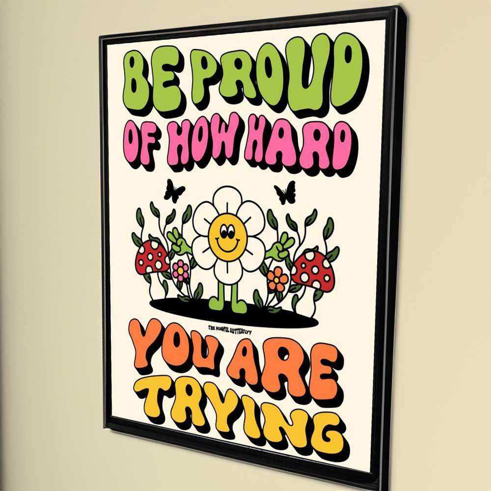 Motivational poster with colorful text and cartoon flowers on a beige wall.
