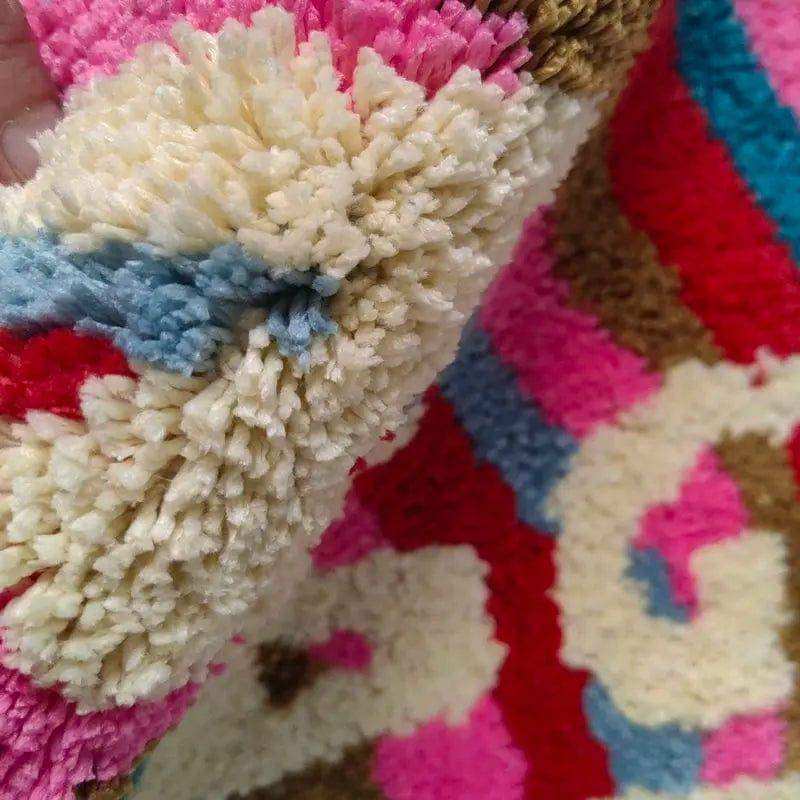 Close-up of a textured fabric with colorful patterns