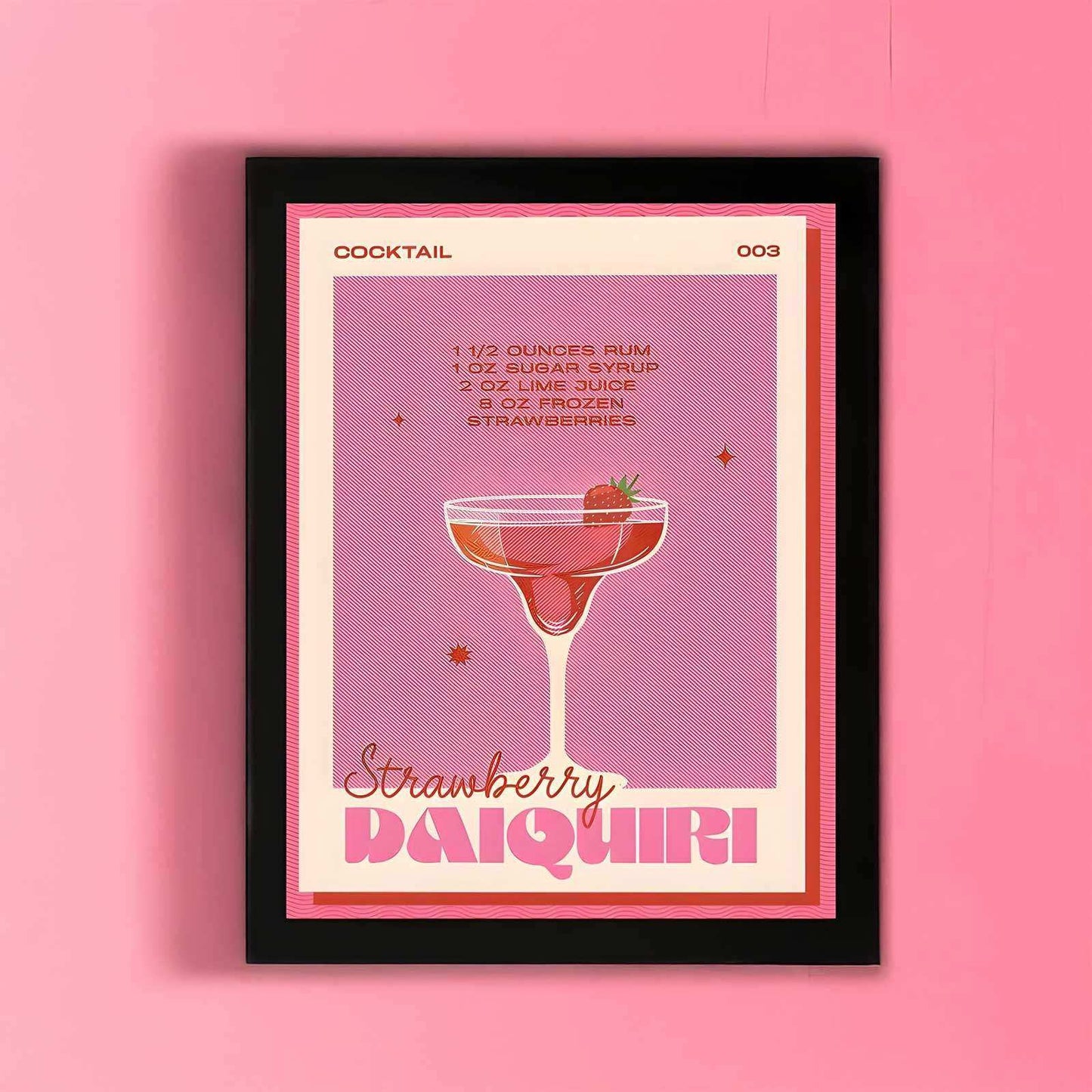 Framed poster of a strawberry daiquiri cocktail recipe on a pink background