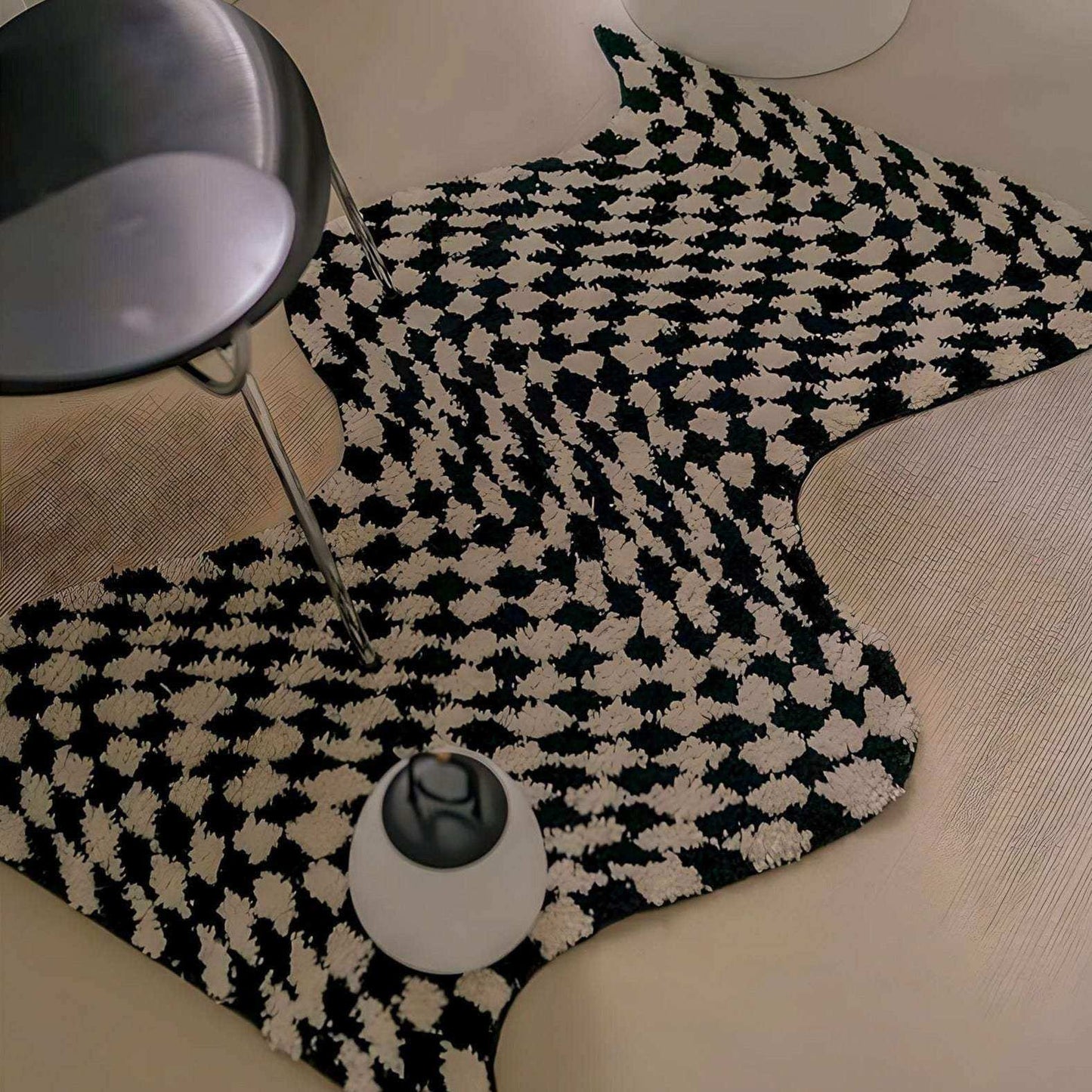 Black and white checkered mat on a wooden floor with a lamp and small round object.