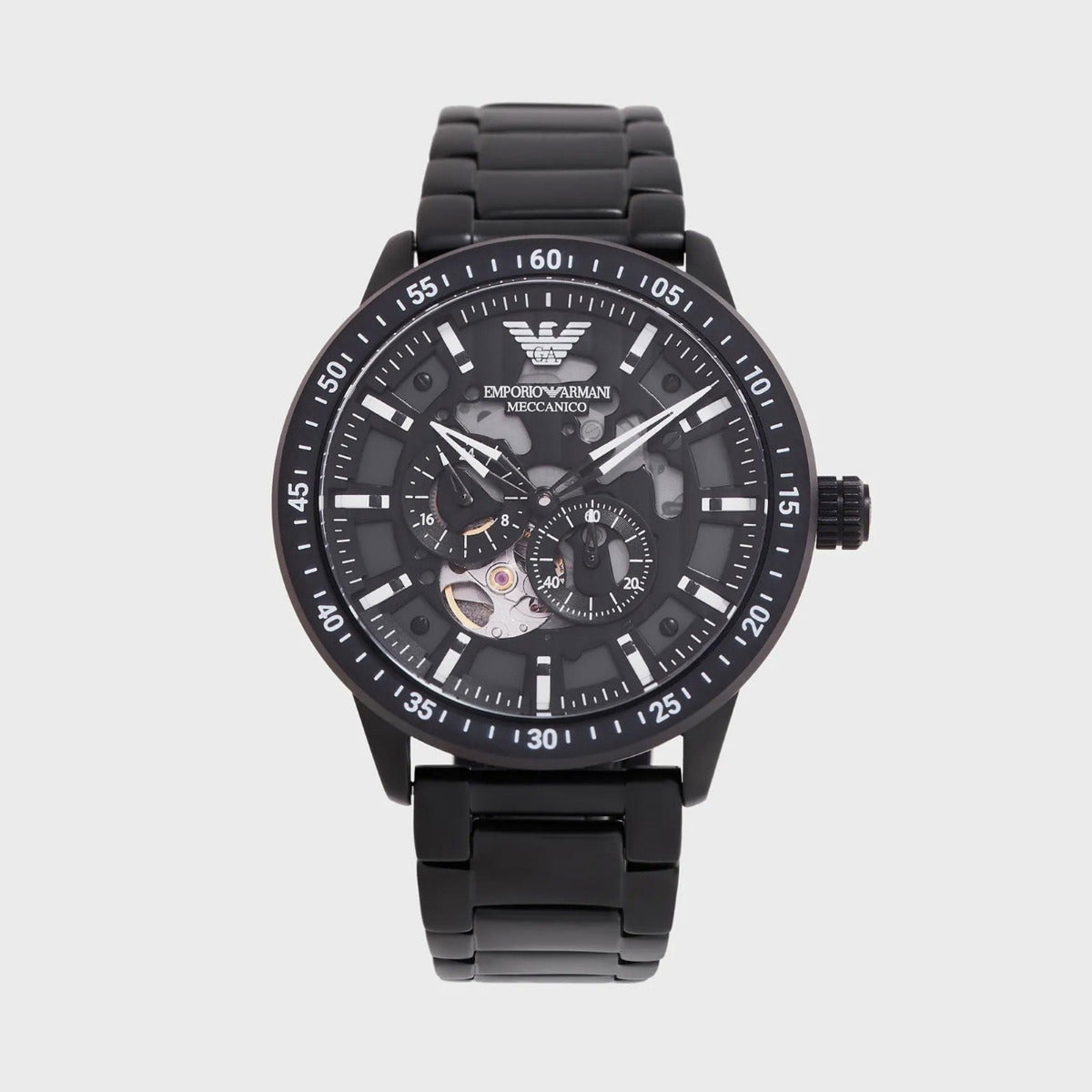 Black Emporio Armani watch on a light gray background