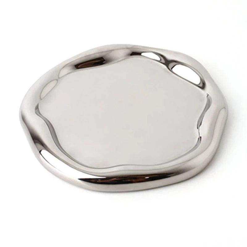 Silver metallic object on a white background