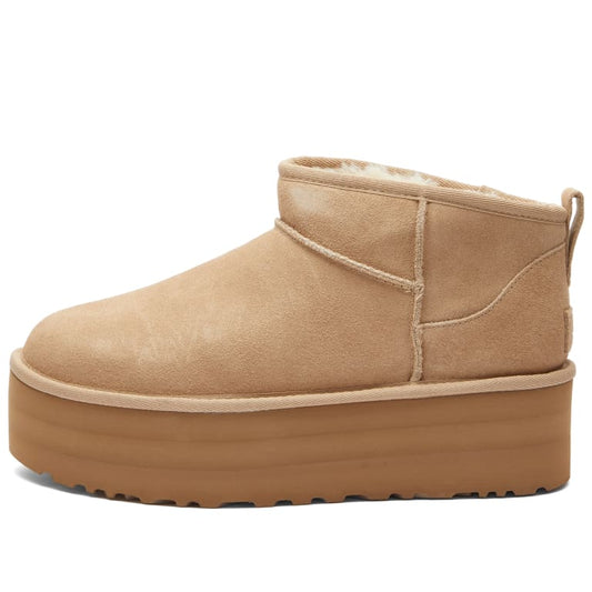 Tan platform boot on a white background