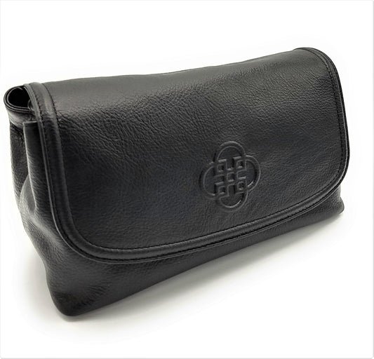 Black leather clutch bag with a central embossed design on a white background