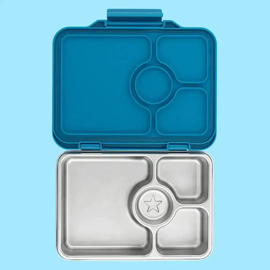 Blue and silver compartmentalized lunch box on a light blue background