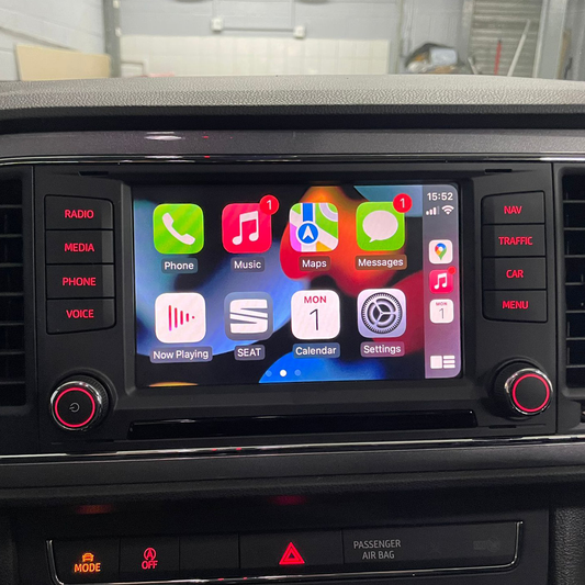 Car dashboard with a touchscreen display showing app icons