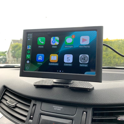 Car dashboard with a mounted tablet displaying app icons