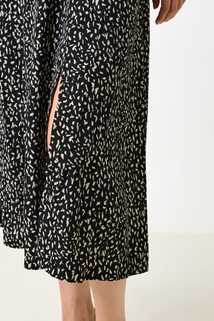 Black dress with white pattern on a white background