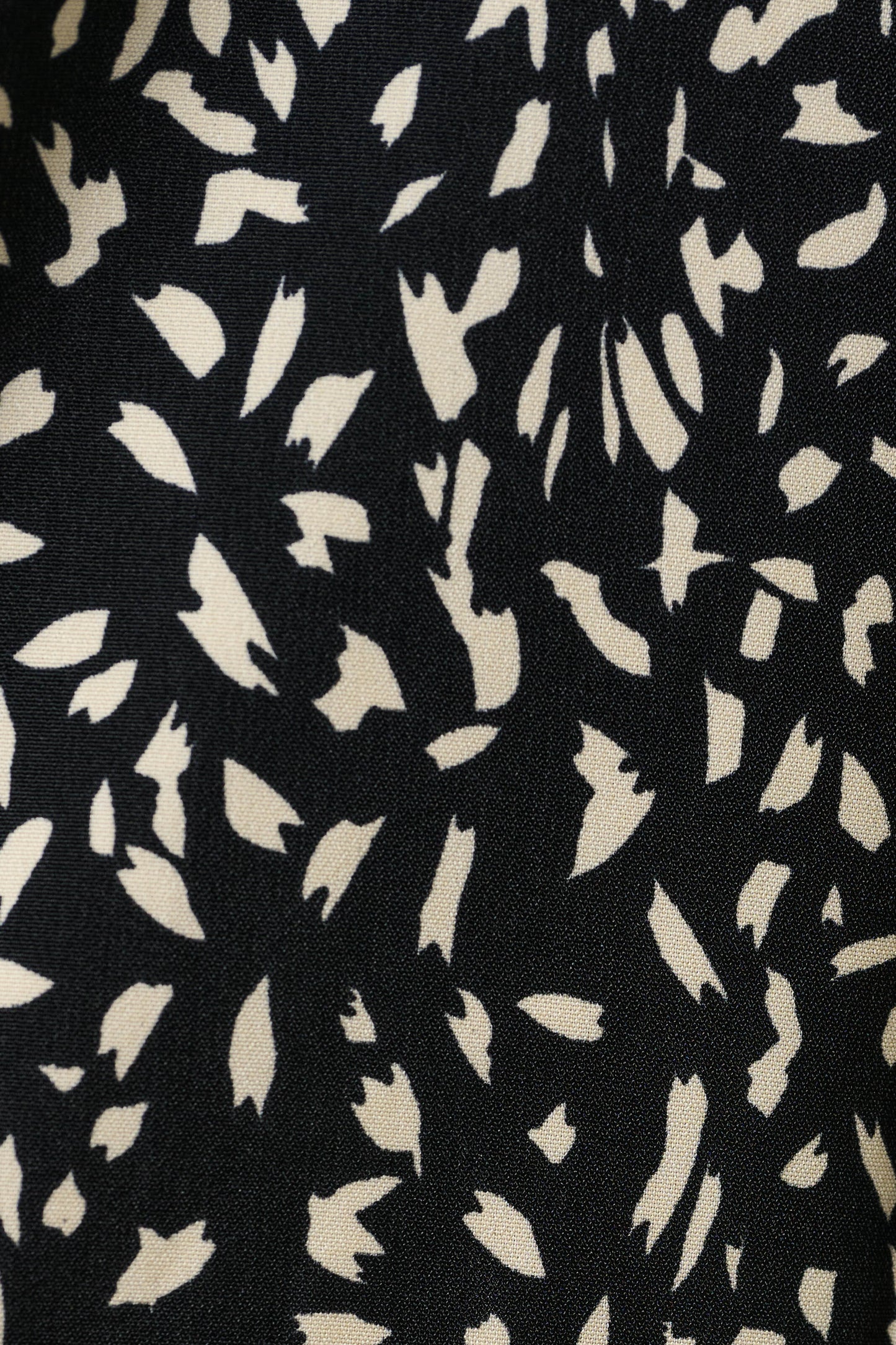 Black fabric with white abstract pattern