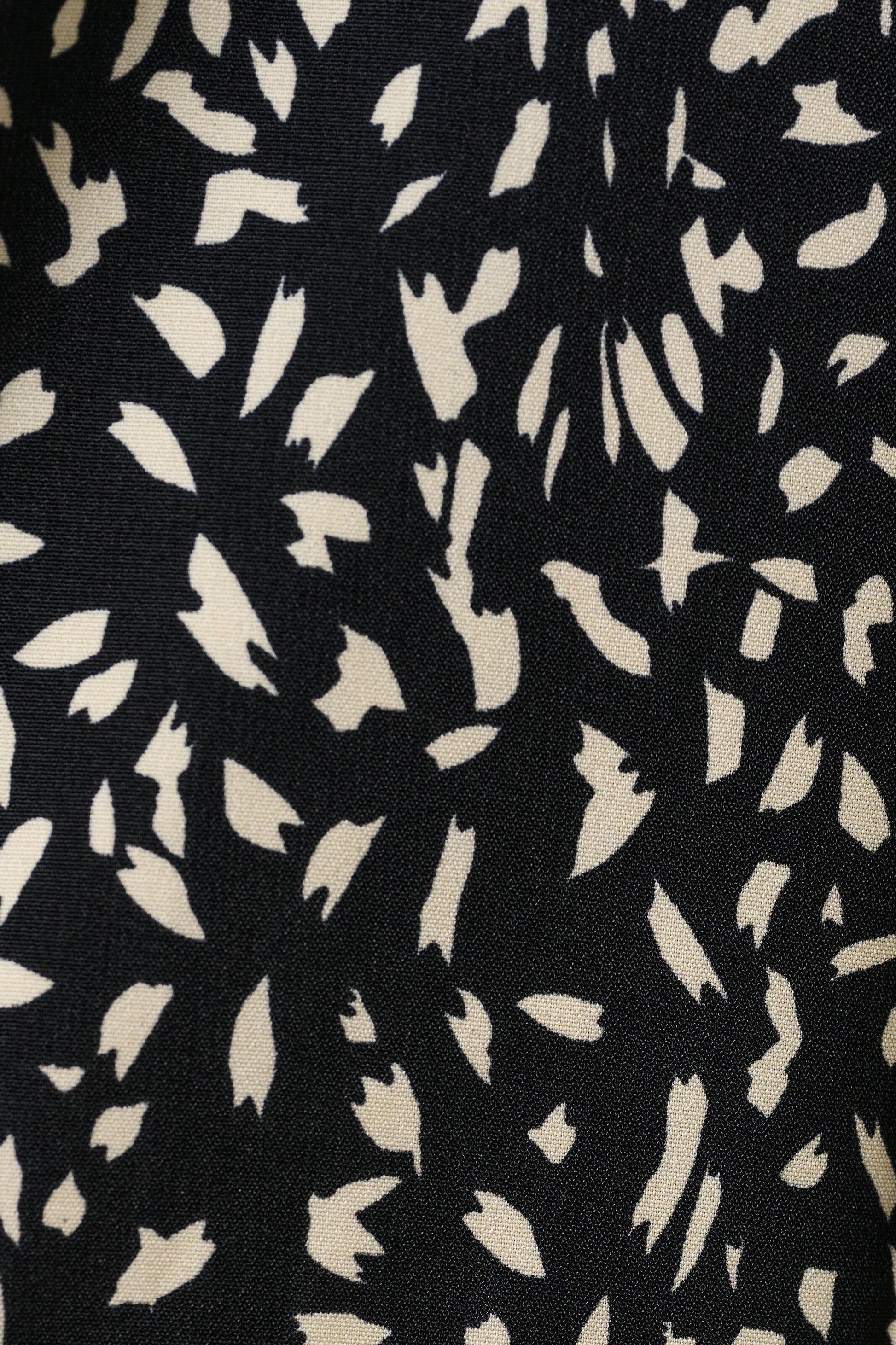 Black fabric with white abstract pattern