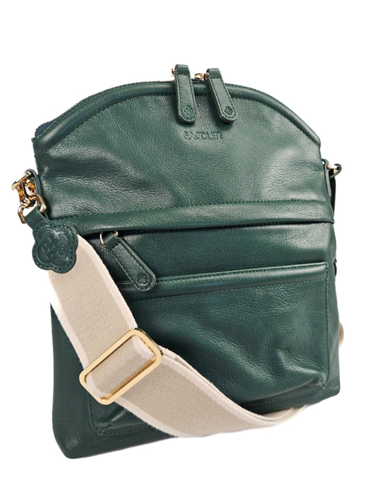 Green leather bag with beige strap on a white background