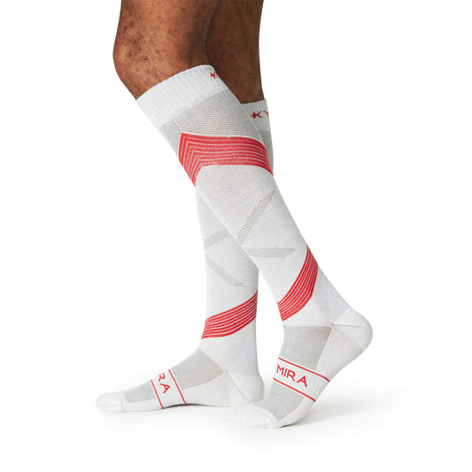 White knee-high socks with red accents on a white background