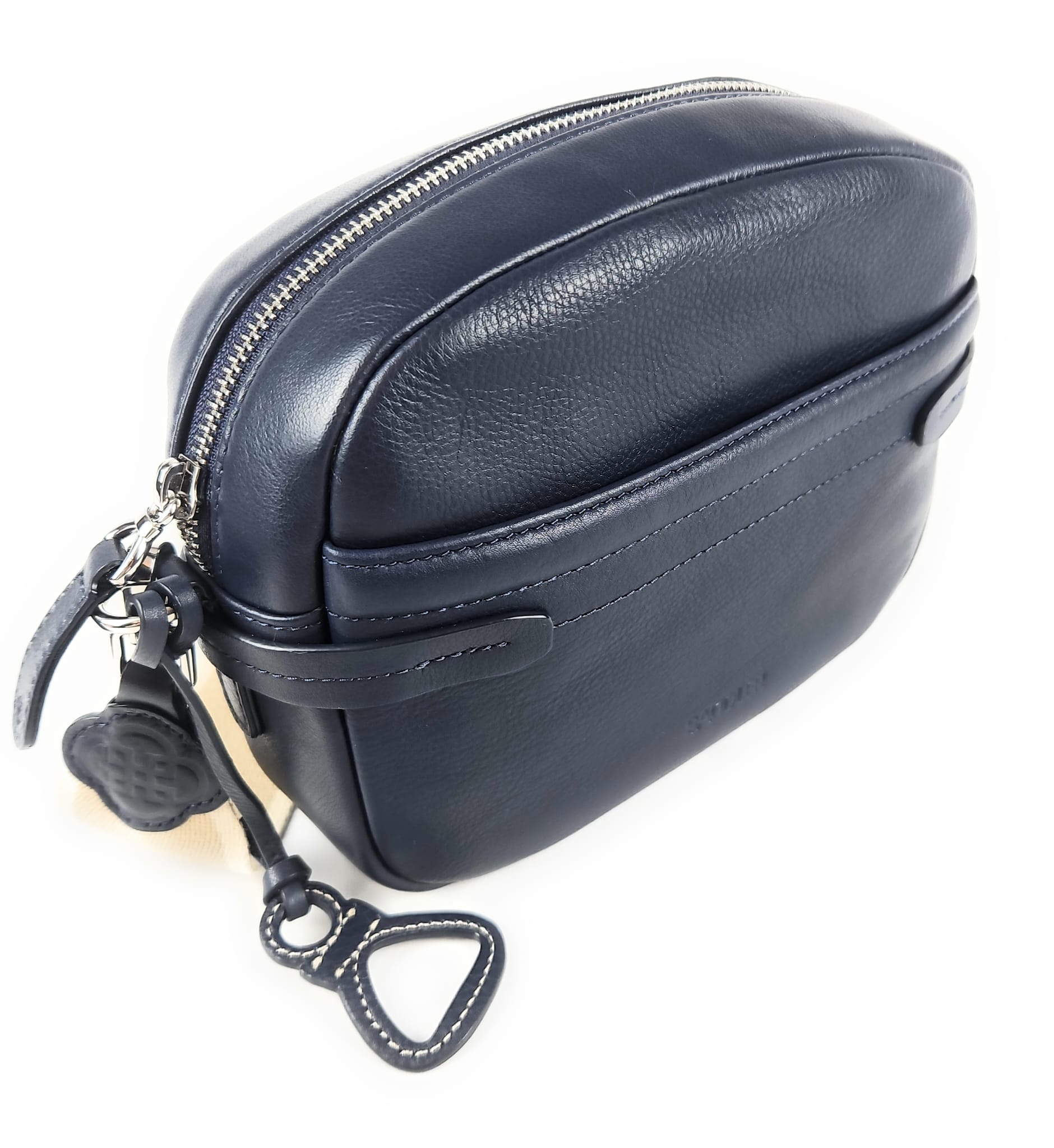 Navy blue leather bag with a strap on a white background