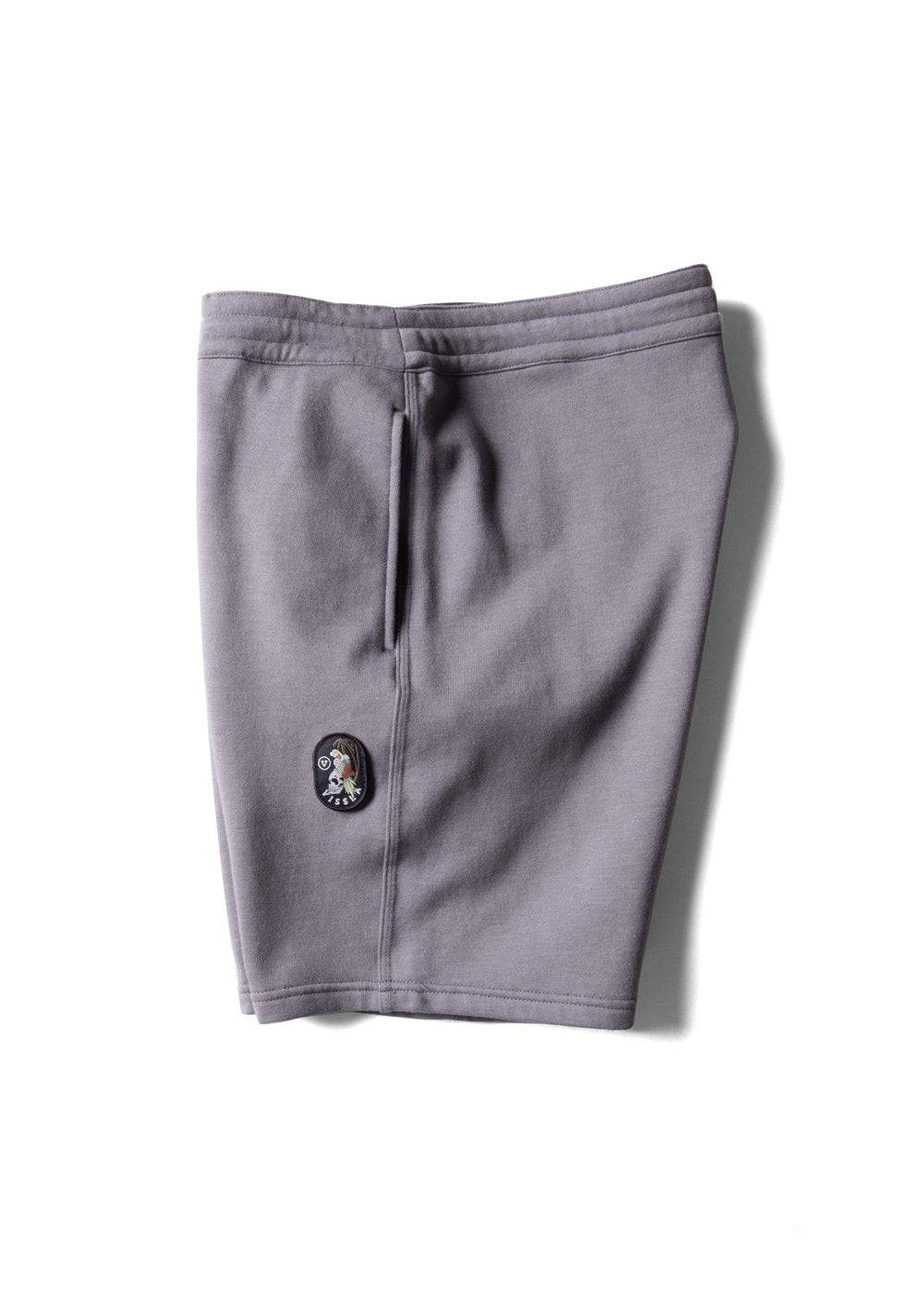 Gray sweat shorts with a logo on a white background
