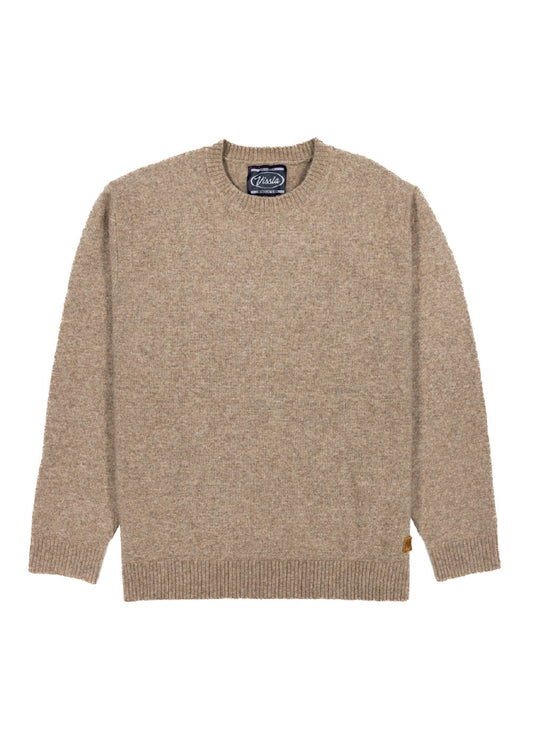 Beige sweater with a brand label on a white background