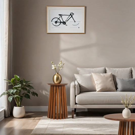 Living room with a gray sofa, wooden side table, and framed bicycle art on the wall.