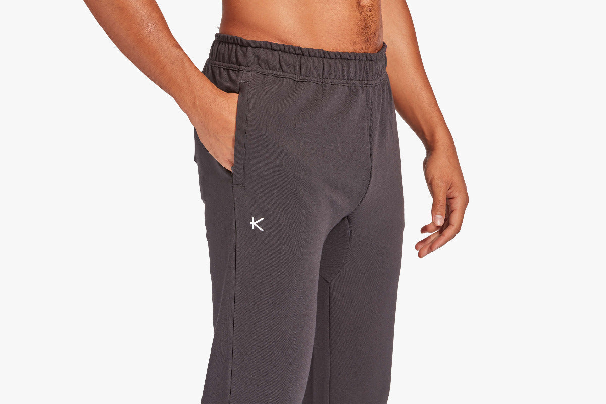 Gray sweatpants with a brand logo on a white background
