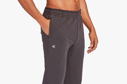 Gray sweatpants with a brand logo on a white background
