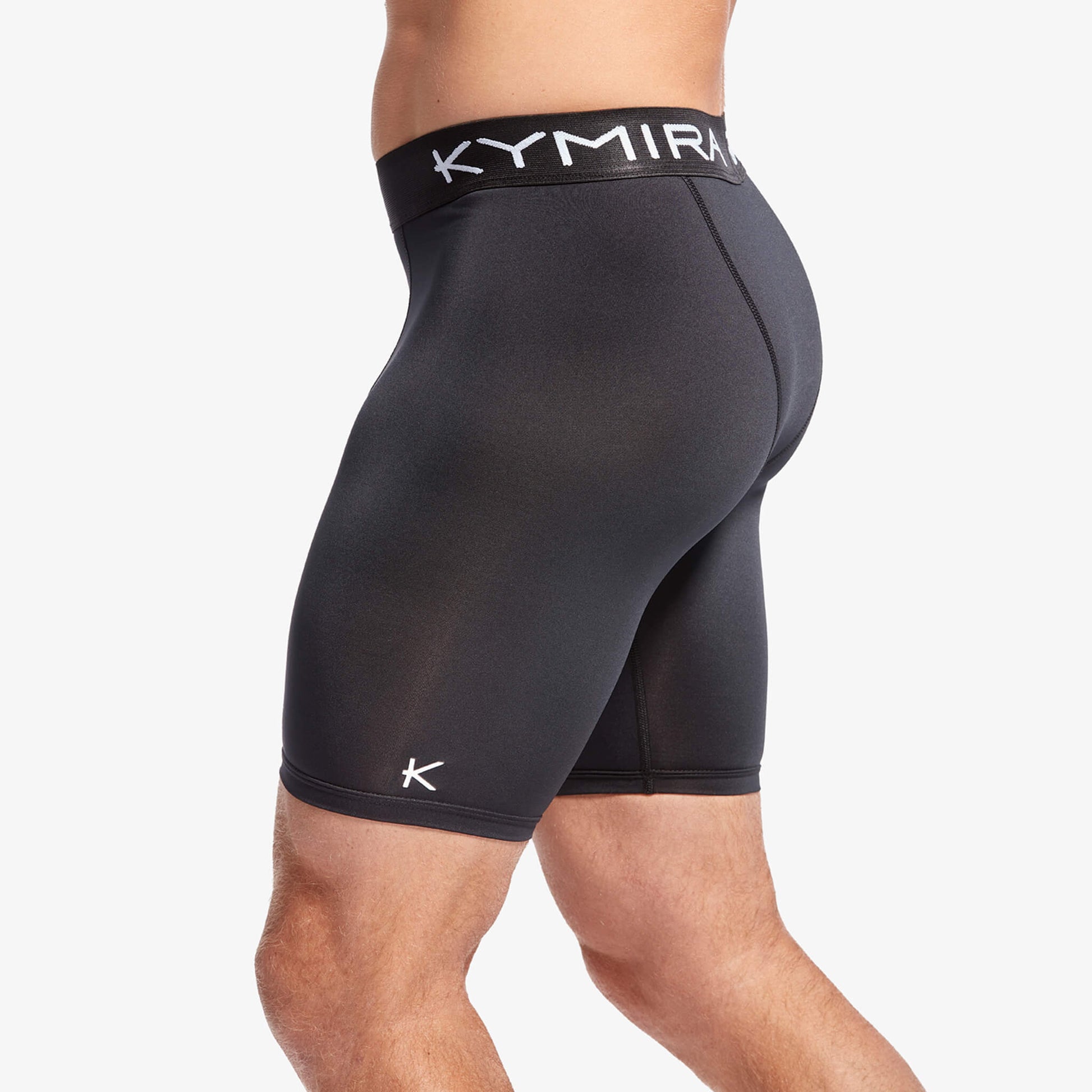 Black athletic shorts with a visible brand logo on a white background