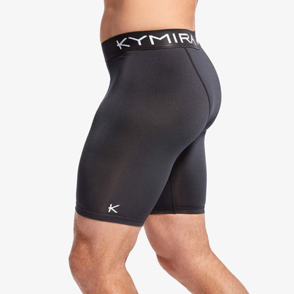 Black athletic shorts with a visible brand logo on a white background