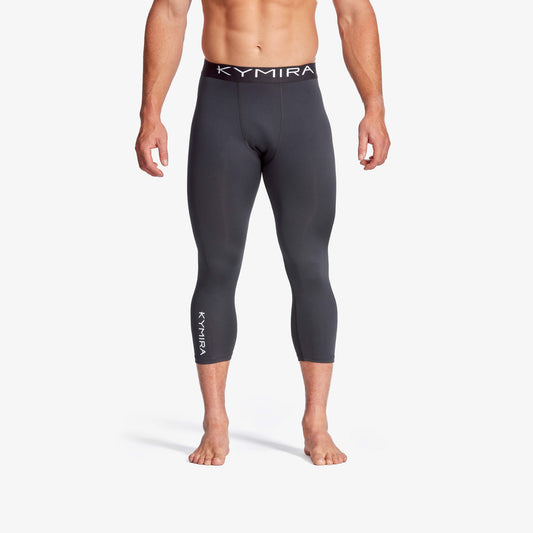 Person wearing black Kymira leggings on a white background