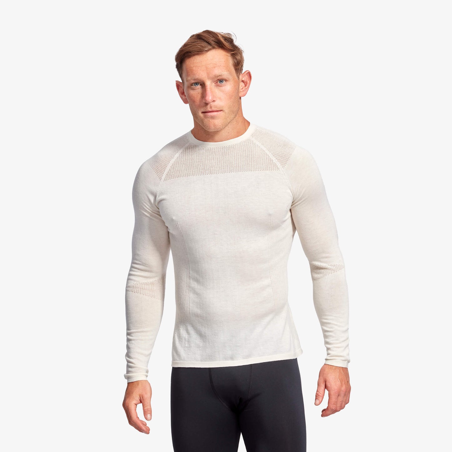 Man wearing a white long-sleeve athletic shirt on a white background