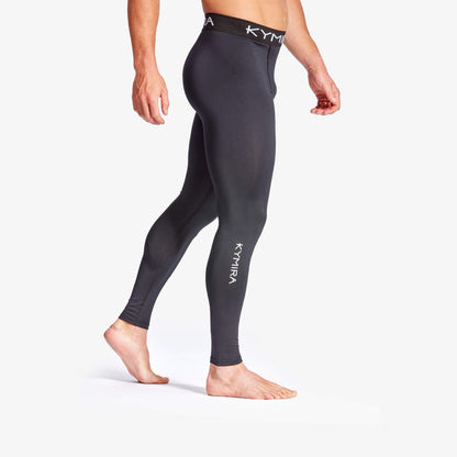 Person wearing black leggings with 'Kymira' branding on a white background