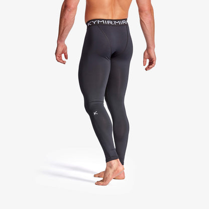 Black compression leggings with visible branding on a white background